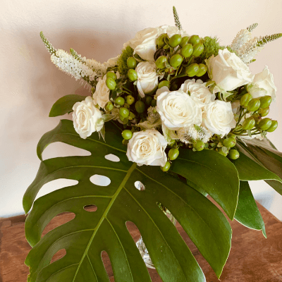 A white and green flower arrangement.
