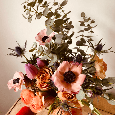Multi coloured flower arrangement .